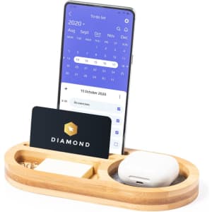A bamboo organiser featuring a mobile phone, card, sticky notes, and AirPods, all in neutral tones.