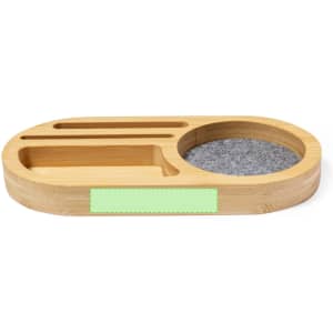 A bamboo organiser with multiple compartments, featuring a circular section lined with grey felt.