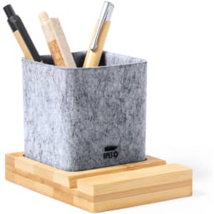 A grey felt pencil holder sits on a wooden base, containing various writing instruments like pens and markers.