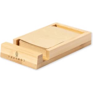 A bamboo notepad holder featuring a sliding drawer filled with blank notepad sheets. It has a simple design and natural finish.