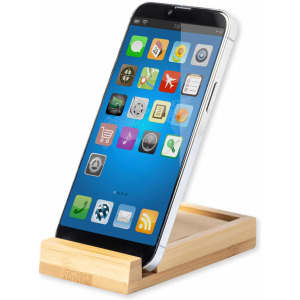 A smartphone displayed on a wooden notepad holder, featuring a sleek design with a light wood finish.