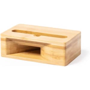 A bamboo sound amplifier with a sleek design, featuring a slot for a phone and an open base for sound projection.