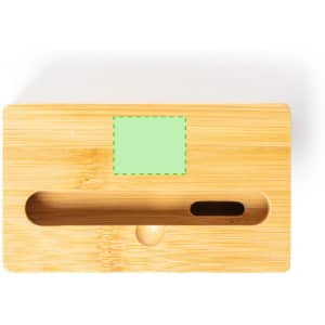 A bamboo phone stand featuring a central slot for devices and a small hole, showcasing a light green label area.