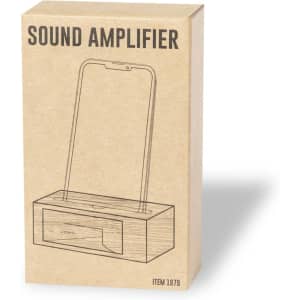 A natural wood sound amplifier in a cardboard box, designed to hold a phone securely for audio enhancement.
