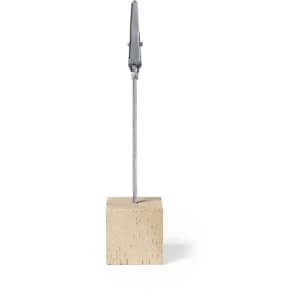 A wooden base supports a metal clip, designed for holding notes or photos. The clip has a silver finish.
