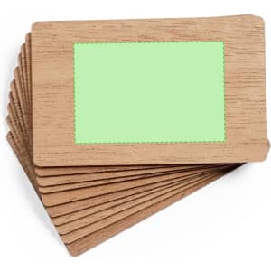A wooden business card set featuring a light green blank area for personalisation.