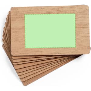 A stack of business cards with a wooden texture and a green centre for customisation.