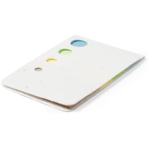 A sticky notepad with a white cover featuring three coloured circles in green, blue, and yellow.