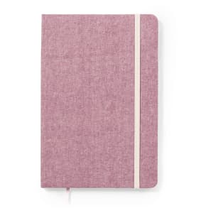 A notepad with a soft pink cover and a white elastic band, featuring a textured finish.