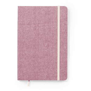 A pink notepad with a fabric cover, featuring a contrasting elastic band and bookmark. It includes a logo.