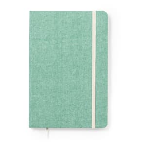 A green notepad with a textured finish, featuring a white elastic band and a bookmark ribbon.