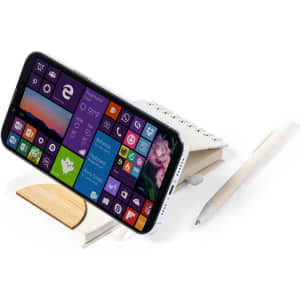 A white notebook with a wooden stand, displaying a phone and accompanied by a pen.