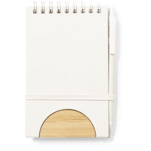 A white notebook with a spiral binding and a bamboo accent, secured with an elastic band.