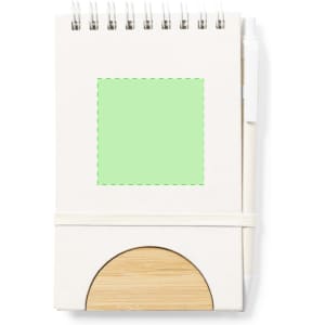 A notebook with a spiral binding, featuring a light green square, beige cover, and bamboo base with an elastic band.