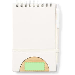 A spiral-bound notebook with a pale cover, featuring a natural wood holder and a green label area.
