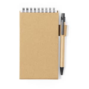 A brown sticky notepad with a spiral binding and a black pen attached.