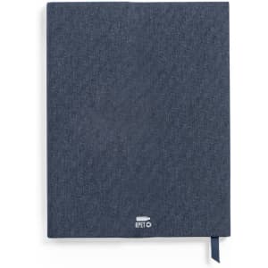 A blue notepad with a textured cover, featuring a ribbon bookmark and a small logo at the bottom.