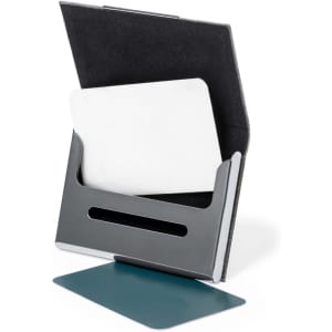 A business card holder with a sleek silver and black design, featuring a prominent slot for cards and a base plate.