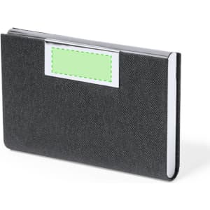A black business card holder with a shiny silver trim and an empty space for a label. It has a logo on the front.