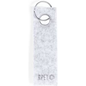A grey felt keyring with a silver metal ring attached, featuring a logo on the felt.