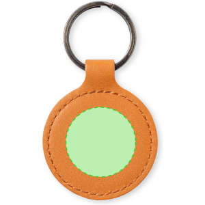 An orange leather keyring with a circular green area in the centre, featuring a metal keyring attachment.
