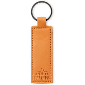An orange recycled leather keyring with a metal ring, featuring a textured surface.