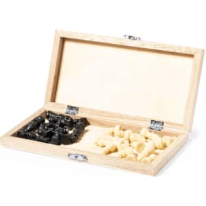A wooden box containing black and white chess pieces, fully organised and ready for play.