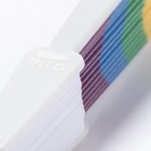 A hand fan with alternating vibrant colours including green, purple, blue, and yellow, featuring a white handle.