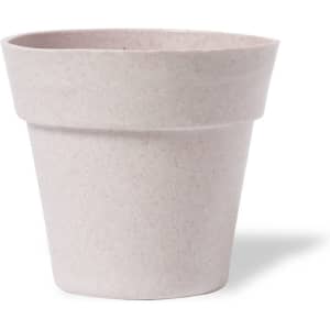 A light pink flowerpot with a tapered design, featuring a smooth finish and a subtle texture.