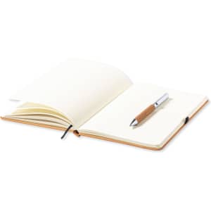 An open notebook with lined pages and a silver pen featuring a wooden grip. The notebook has a tan cover.