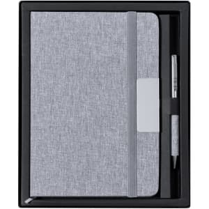 A grey notebook set with a pen, presented in a black gift box. The notebook features a band closure.