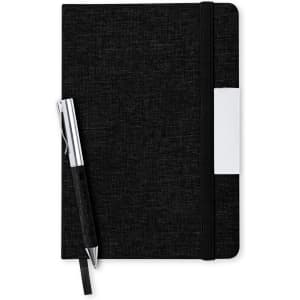 A black notebook with an elastic band and a silver pen lying beside it. The notebook features a branding logo.