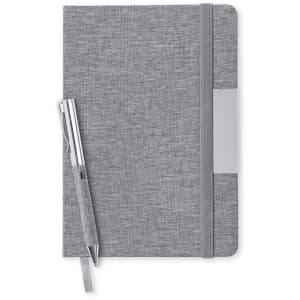 A grey notebook with a pen, featuring a textured cover and an elastic band closure. The notebook has a logo.