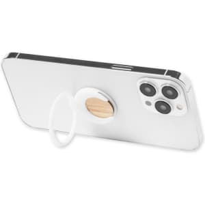 A white phone stand with a wooden accent and a circular ring holder attached to a smartphone.