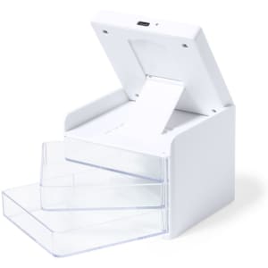 A white organiser charger with three clear drawers and a top compartment for charging devices.
