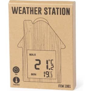 A weather station packaged in a box resembling a house, featuring a digital display for temperature readings.