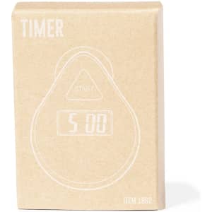 A timer in a brown cardboard box with a minimalist design and a digital display indicating "5:00".