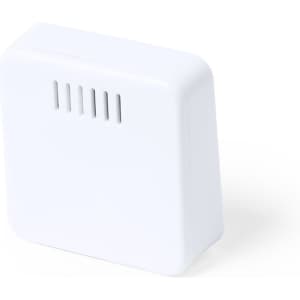 A white weather station device with a sleek, compact design and ventilation slits on the side.