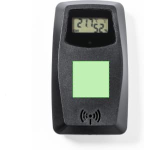 A black weather station device with a digital display, featuring a green section and a wireless symbol.