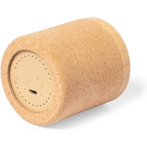 A cylindrical cork speaker in neutral tones featuring a simplistic design and a logo. Ideal for phone and technology use.