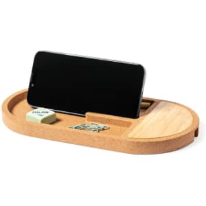A cork organiser charger in natural tones, featuring a smartphone slot and compartments for stationery items.