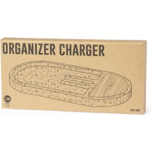 A rectangular box containing a wireless charger in a natural colour with a wood accent and a logo.