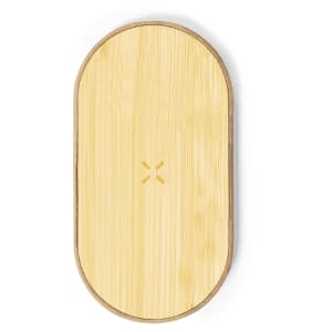 A wireless charger featuring an oval design made of bamboo with a wooden border and a subtle logo.