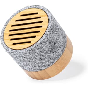 A cylindrical speaker with a bamboo base and grey fabric covering, featuring slotted speaker openings on top.