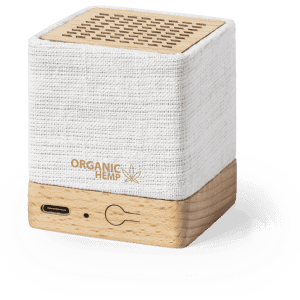 A compact speaker featuring a white fabric and wood design, with a USB-C port and a small logo.