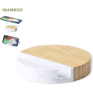 A circular wireless charger holder in bamboo and white marble, featuring a sleek design with a logo.