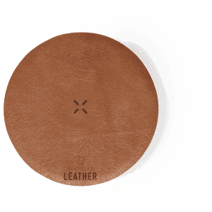 A round wireless charger in tan leather with a textured surface, featuring a subtle logo.