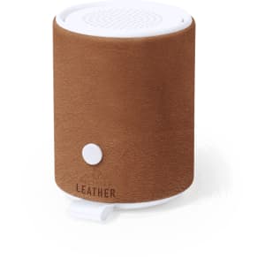 A brown leather speaker with a white base and a button on the front, featuring a textured surface.