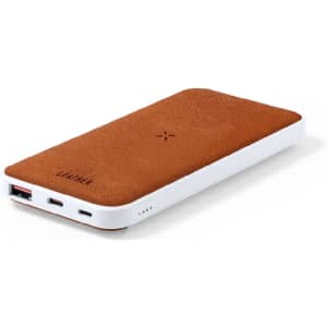 A power bank with a suede brown surface and white trim, featuring USB ports and an indicator light. It has a logo.