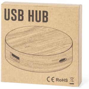 A round, wooden-effect USB hub in a simple cardboard packaging with a logo and line drawing.